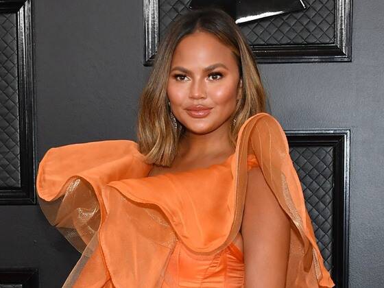 Chrissy Teigen Claps Back at Body Shamer After Sharing Swimsuit Selfie