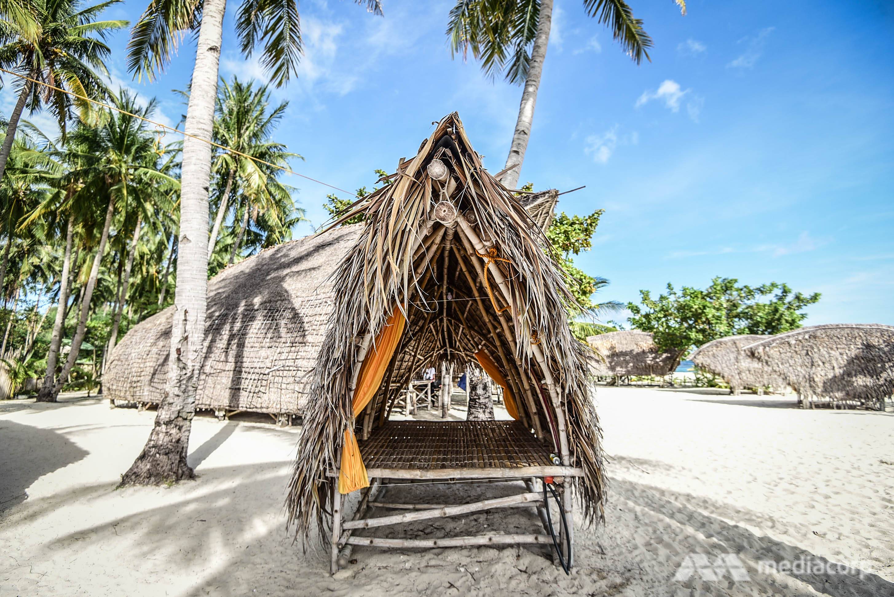 'It’s easy to make and very cheap’: Filipino carpenter designs typhoon-resilient huts to fight climate change