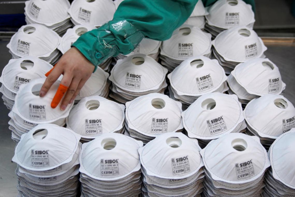 Coronavirus: Chinese factories suspend own production to make masks in fight against virus