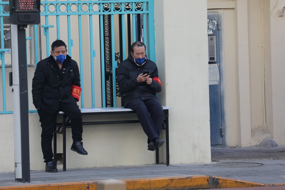 Coronavirus prompts Beijing residential lockdown as millions return to work