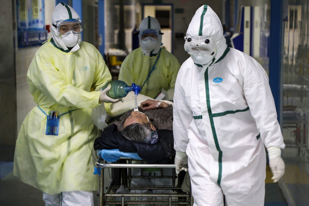 Coronavirus: Wuhan doctors battle outbreak in diapers as masks rub their faces raw
