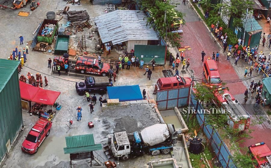 Condo calamity: One rescued, another trapped