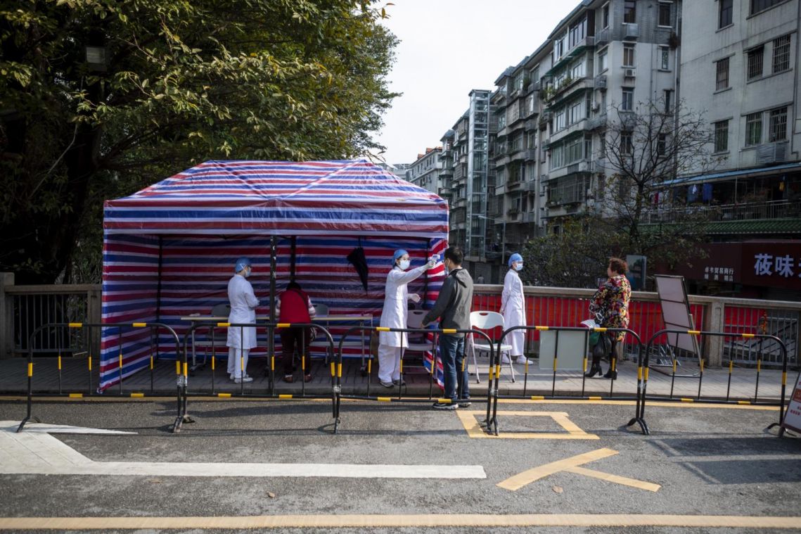 China expands chaotic dragnet in coronavirus crackdown