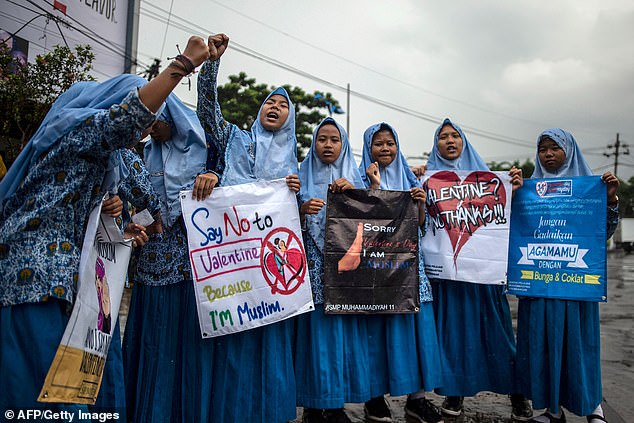 Valentine's Day ban sees dozens of unmarried couples arrested and crackdown on public displays of affection in Muslim-majority Indonesia