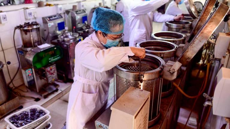 China’s Hubei province reports 96 new virus deaths