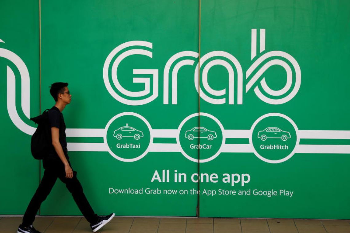 Grab drops cash advance scheme for its drivers and riders