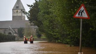 Storm Dennis: Care home staff carried through floods by tractor