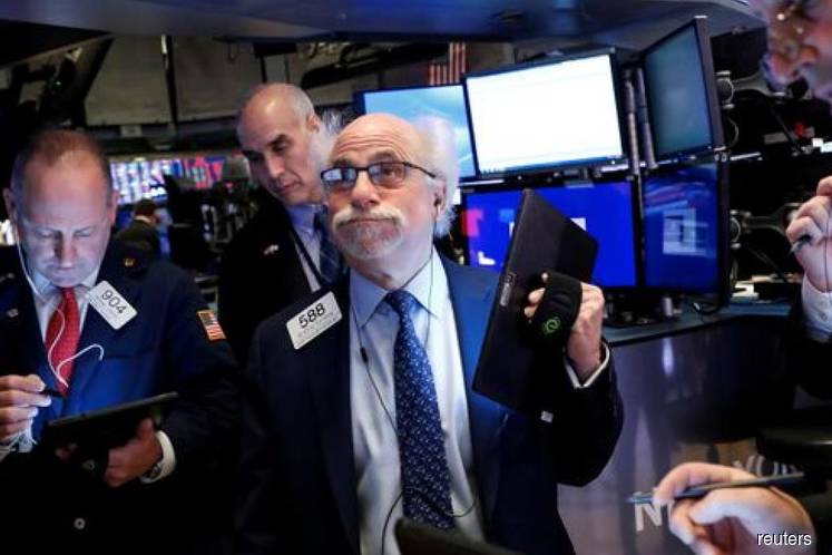 Wall Street sinks as pandemic fears rattle investors