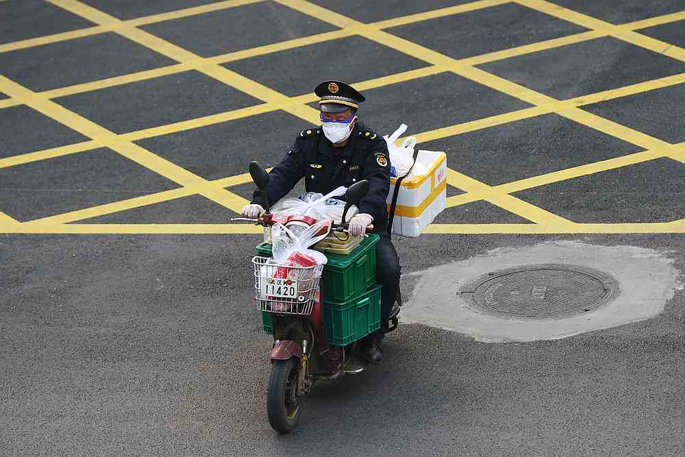 China's Hubei sees rise in new Covid-19 cases as infections slow in other provinces