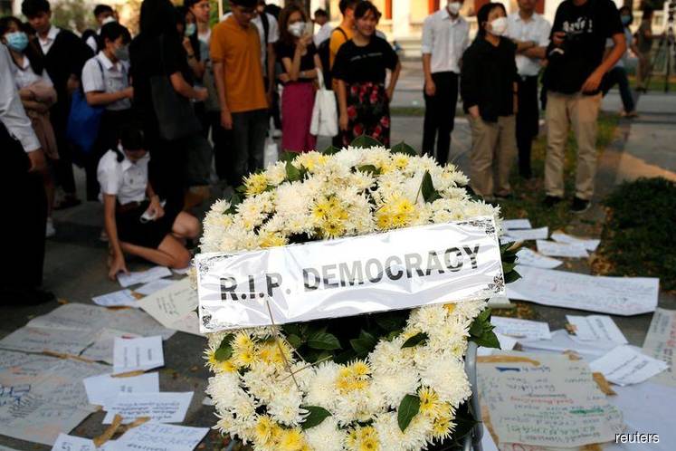 'RIP Democracy': Thai students protest party ban as opposition grills PM in parliament