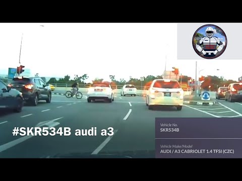 audi beating red light and cyclist had to ebrake