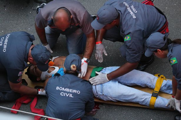 DJ Diplo rushes to cover after shooting breaks out at carnival in Brazil