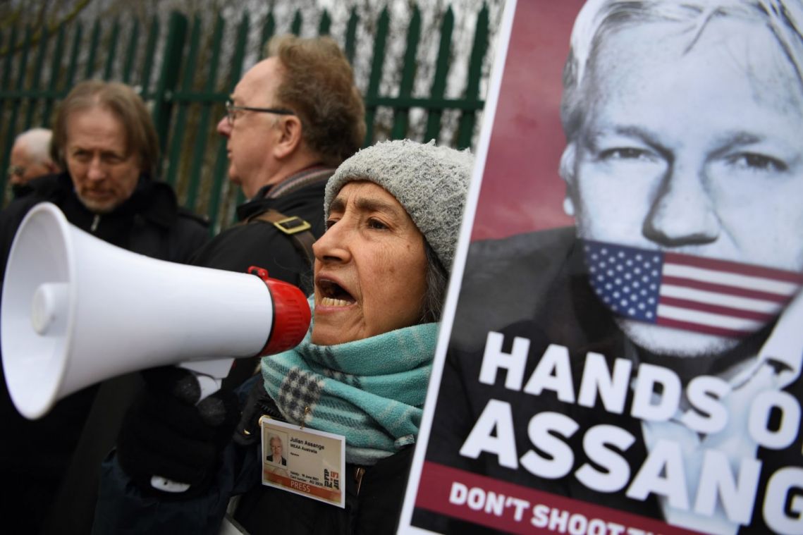 Julian Assange in British court outburst over distance from lawyers
