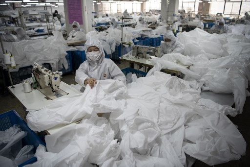 In virus-hit China, coat maker adapts to make hazmat suits