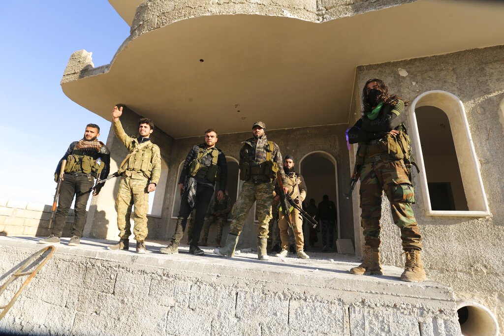 Russian air raids kill 11 civilians as regime retakes key Syrian town