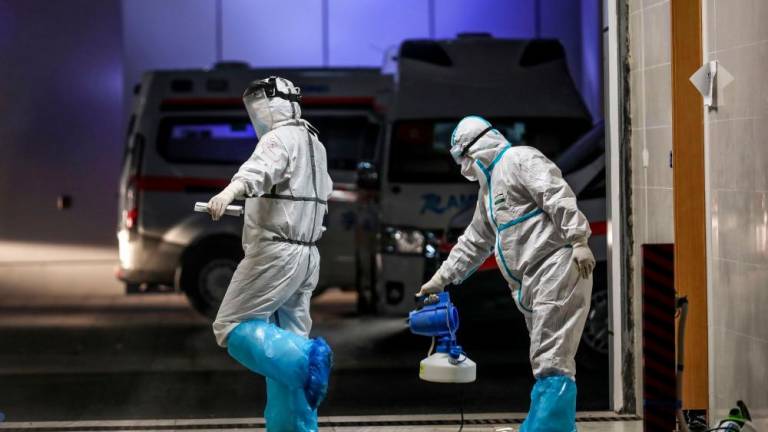 China reports fall in new virus cases for third day, 38 more deaths