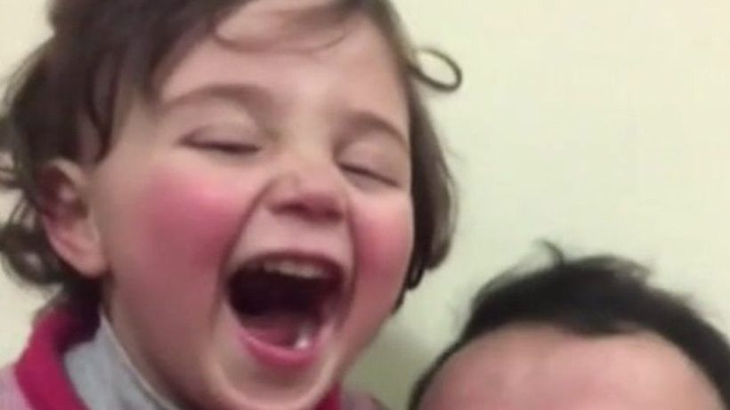 Syria war: Three-year-old girl who laughed at bombs escapes to Turkey