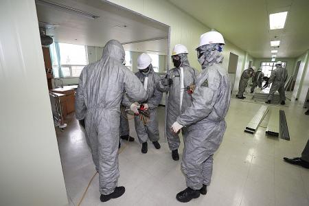 Many wait for hospital beds in S. Korea as coronavirus cases surge