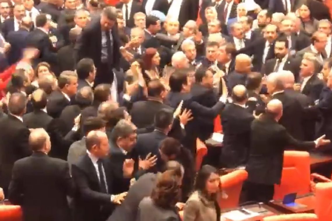 Fists fly in Turkish parliament after opposition MP criticises President Erdogan
