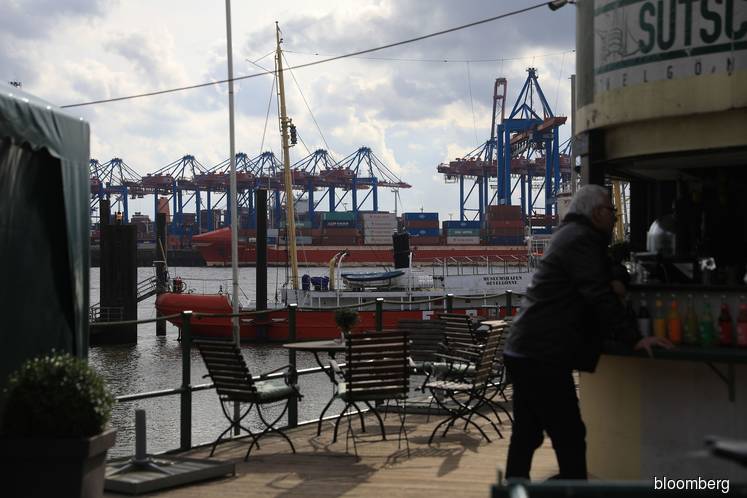 Global economy gripped by rare twin supply-demand shock