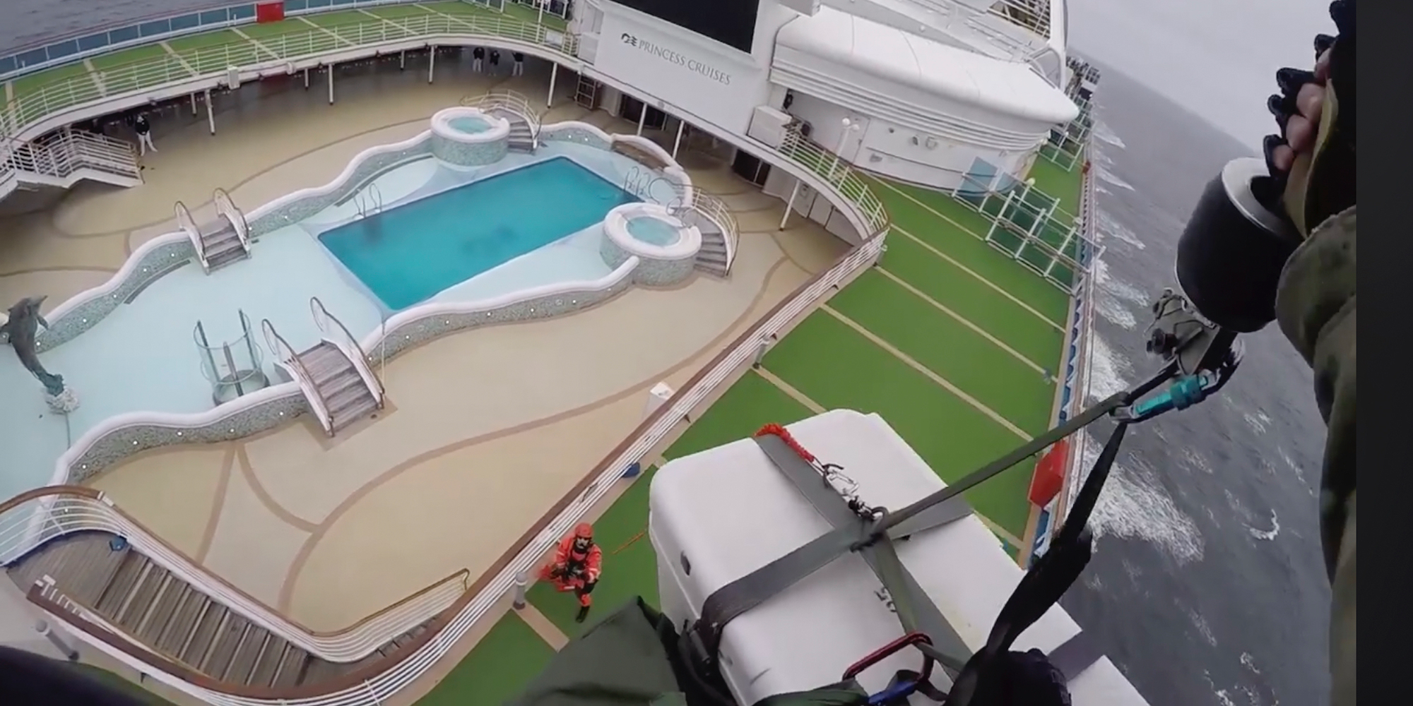 Wild video shows a military helicopter dropping coronavirus test kits to the Grand Princess cruise ship