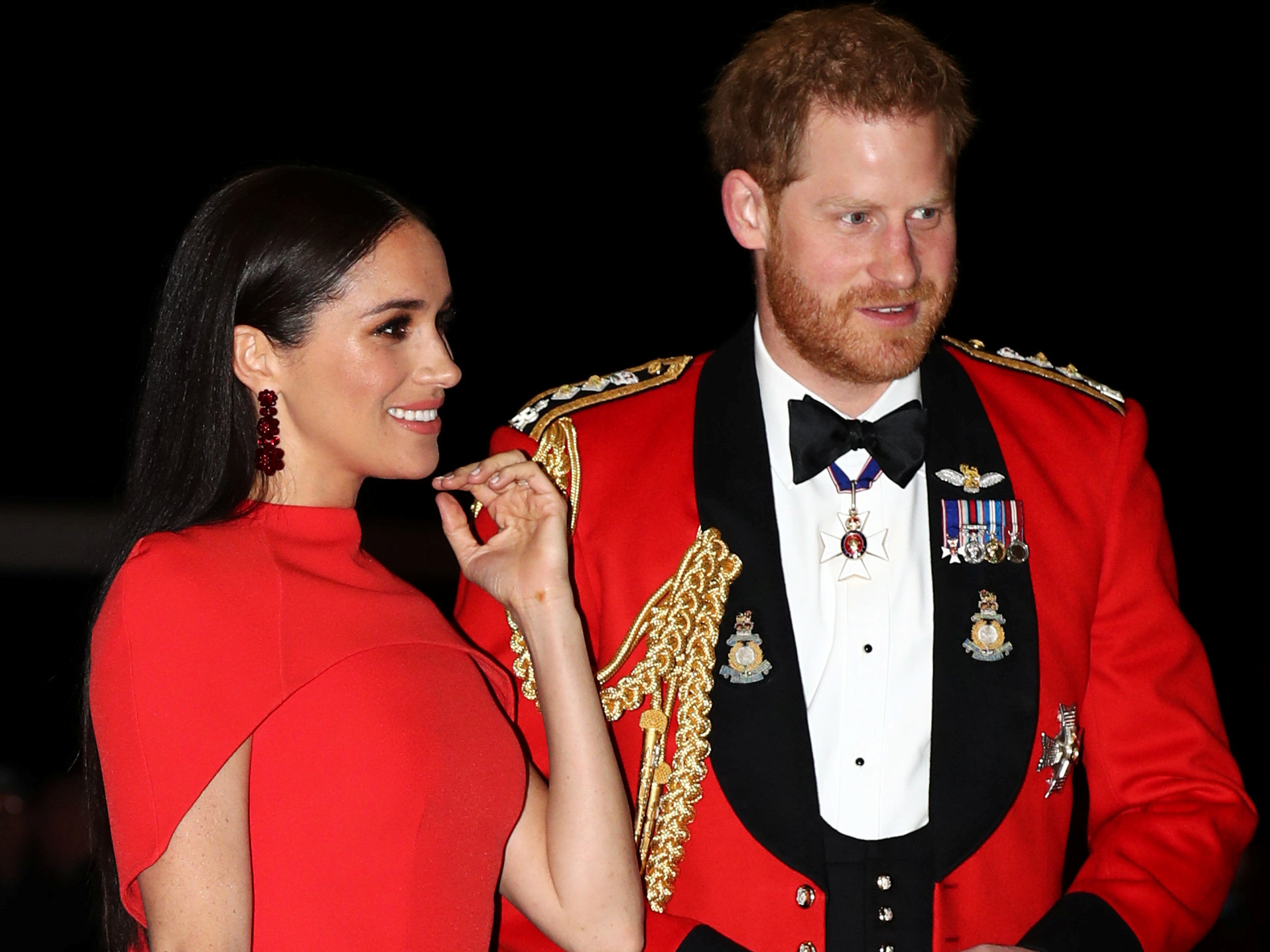 Meghan Markle and Prince Harry matched in bright red at one of their final engagements as working royals