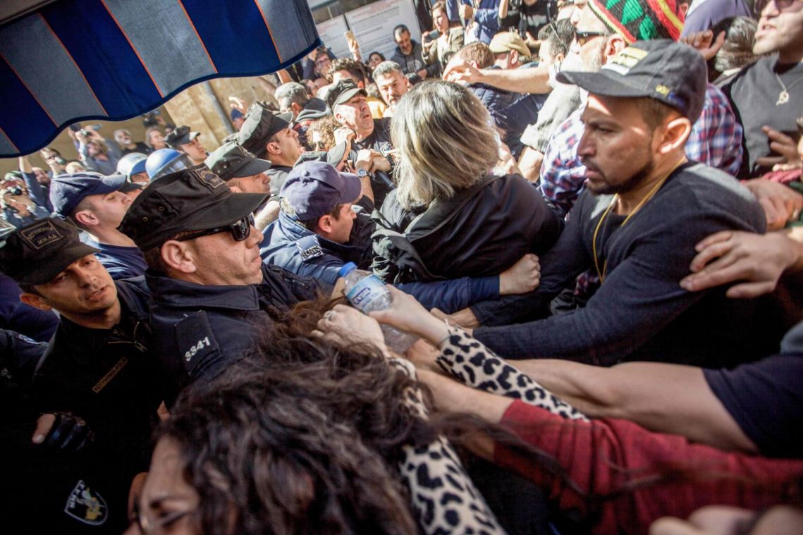 Coronavirus: Protesters, police scuffle at closed Cyprus checkpoint