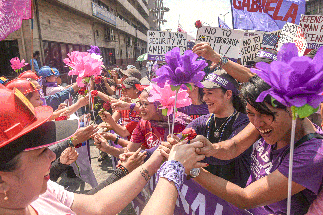 Thousands rally in Asia for Women’s Day despite fear over worsening epidemic     