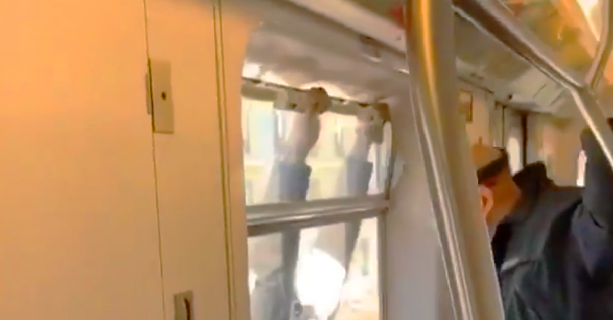 Man filmed hanging on for dear life on outside of moving subway train