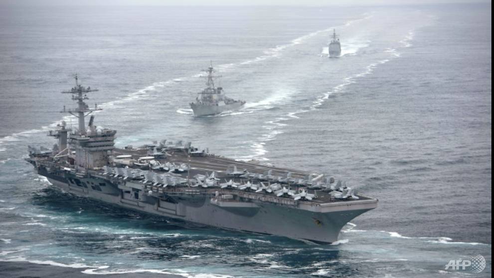 Virus cases spike on US aircraft carrier