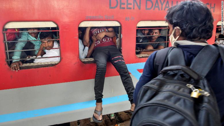 Migrant workers sprayed with disinfectant in one Indian state