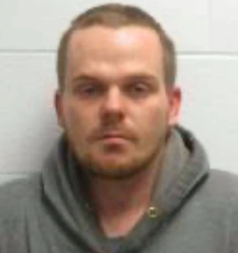 Man coughs on dollar store coolers and scrawls 'covid 19' in condensation: police