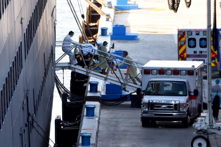Passengers from virus-hit ships start leaving Florida