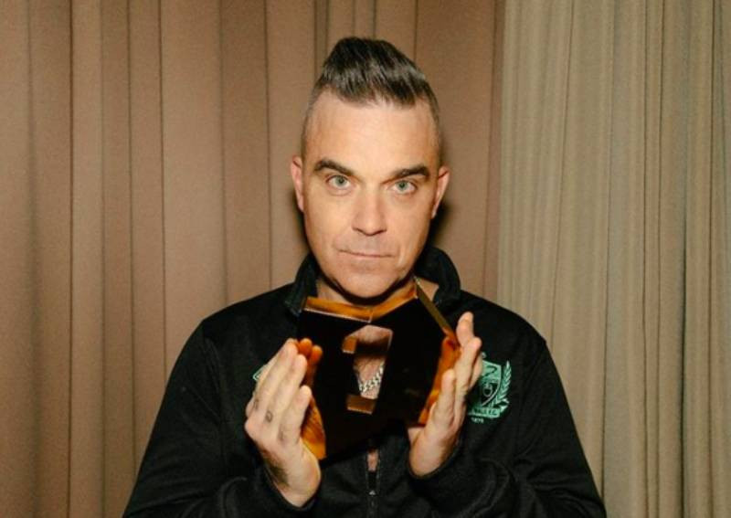 Robbie Williams got down on knees and prayed after developing coronavirus symptoms