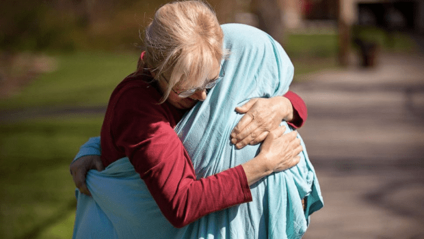 Mother covers coronavirus nurse daughter in blanket so she can hug her