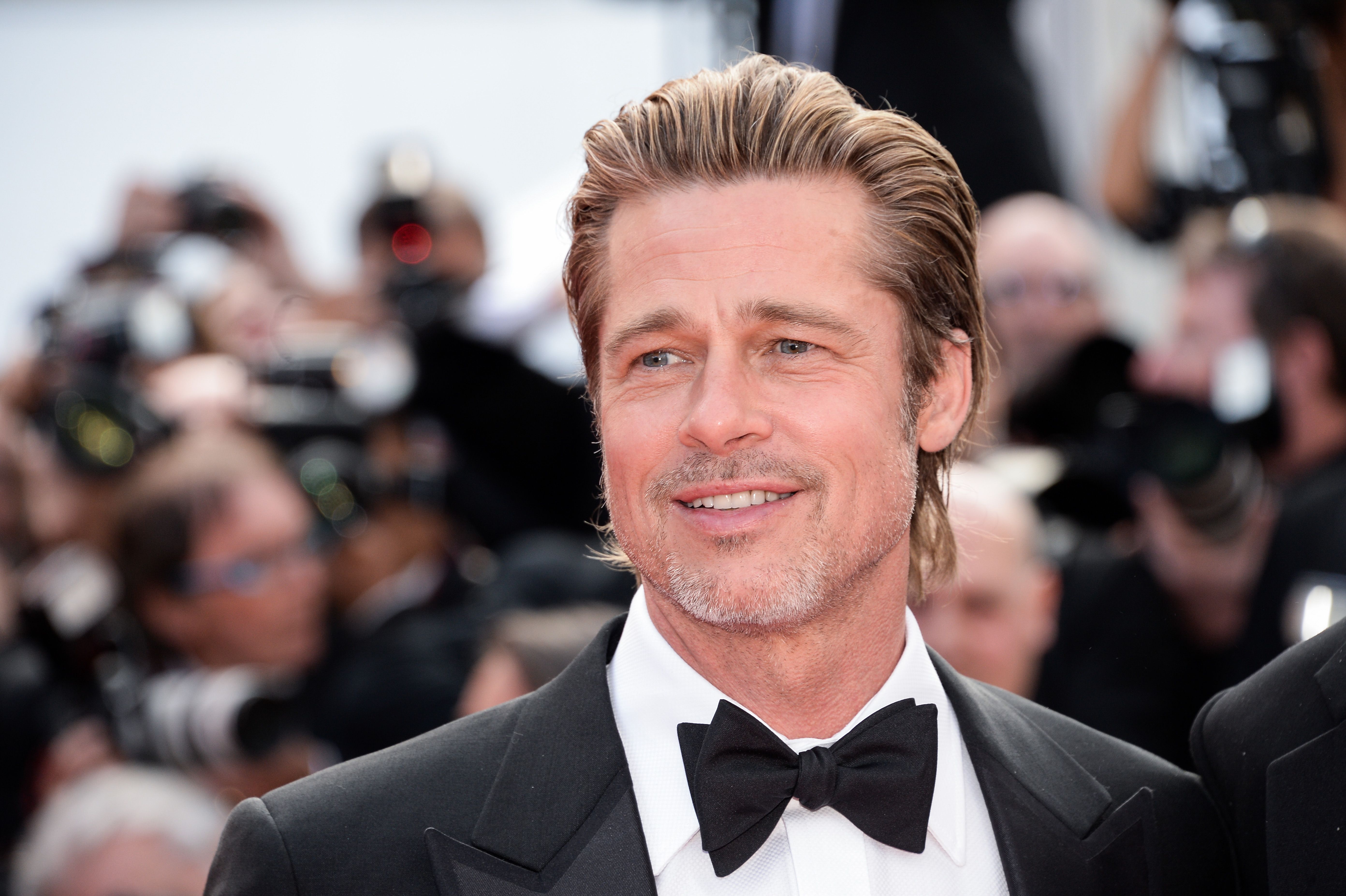 Brad Pitt Says His Makeup Artist Once Had to Cover Up Tan Lines on His Butt