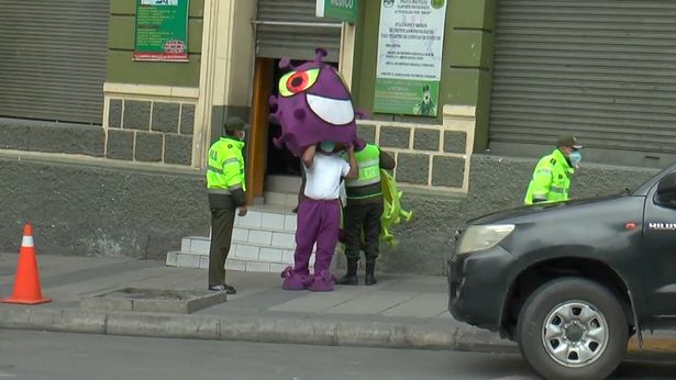 Police encourage social distancing - by dressing up as the coronavirus itself