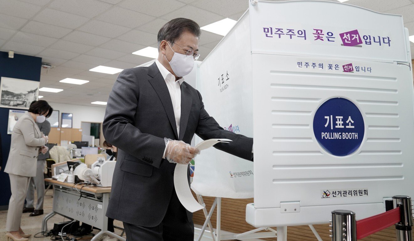 South Korea election: victory for Moon Jae-in’s party as voters turn out in record numbers despite virus