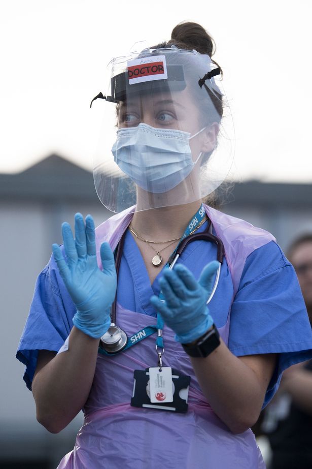 Coronavirus: NHS staff to be asked to treat patients 'without gowns' and to re-use PPE