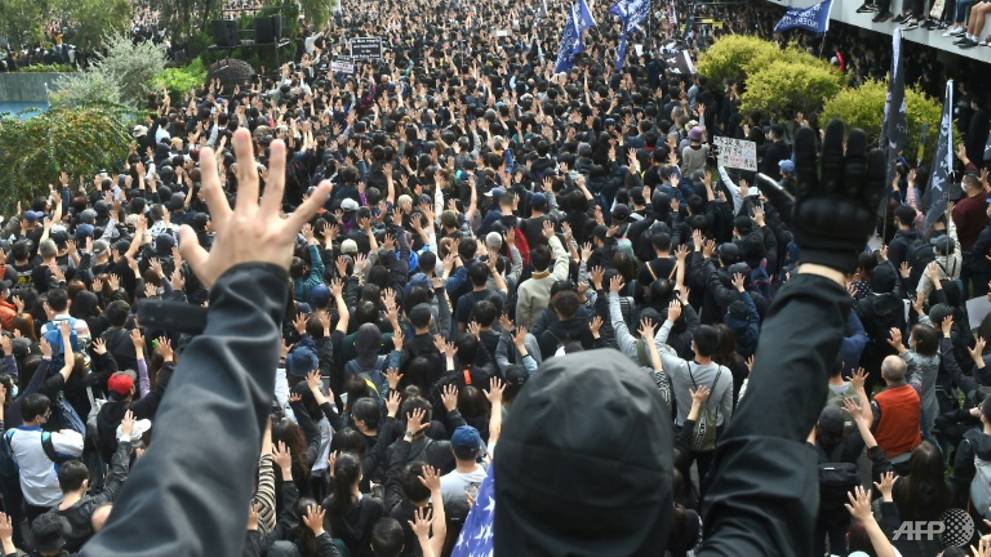 Hong Kong teens charged with murder over death of man hit by brick during protest