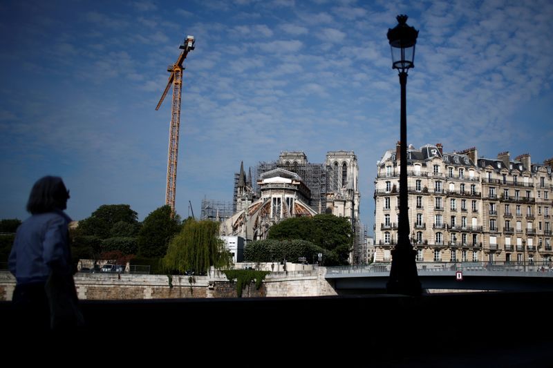Builders back at notre-dame cathedral in Paris after coronavirus shutdown