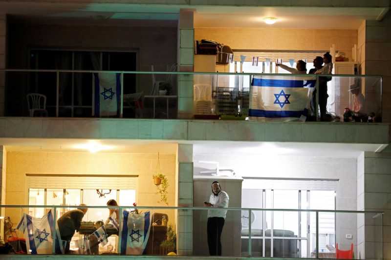 Fly-past, flags on rooftops mark Israel's independence day under lockdown