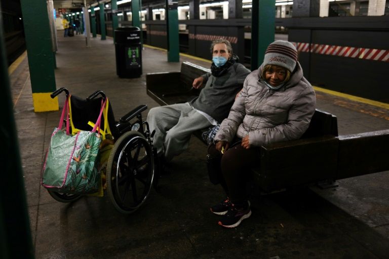 New York's homeless flock to empty subway trains