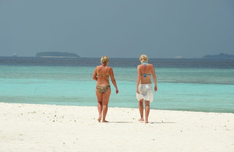 Asia virus latest: first Maldives death, Australia eases curbs