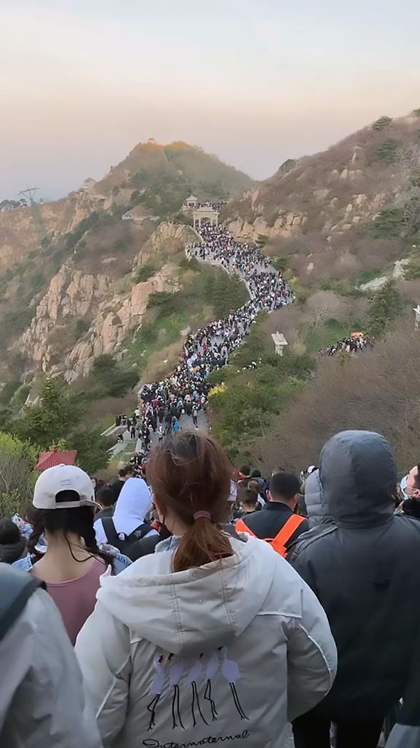 Coronavirus social distancing ignored in China as 30,000 flock to watch sunrise - PICTURED