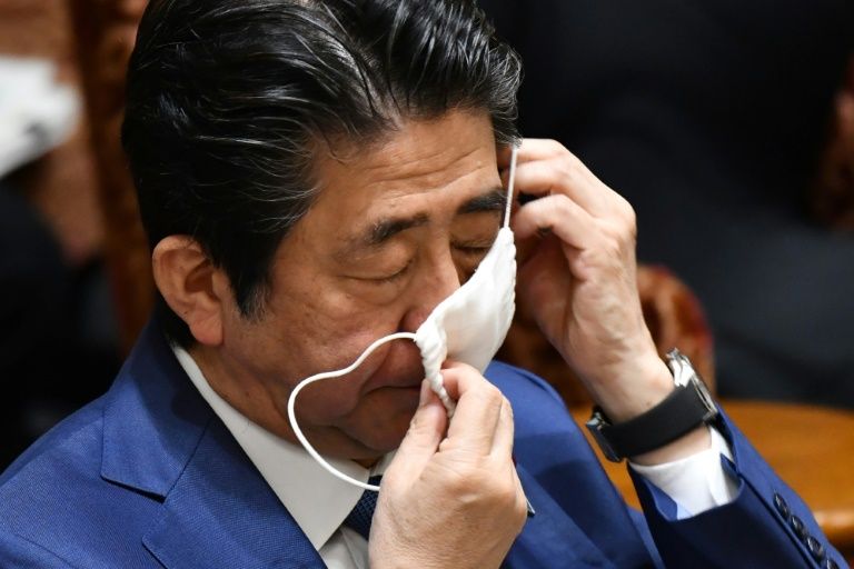 Japan extends virus state of emergency until May 31