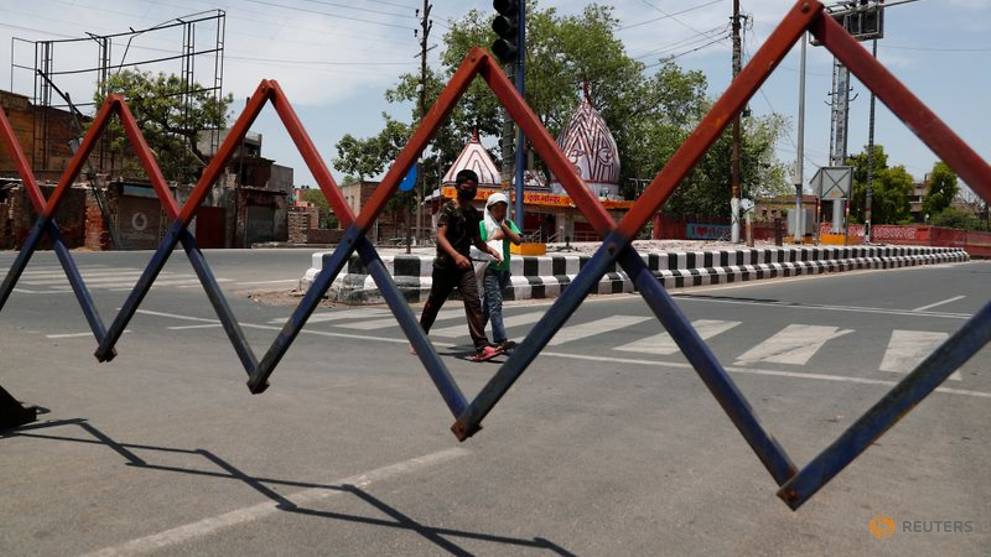 Police clash with migrant workers as India eases coronavirus curbs