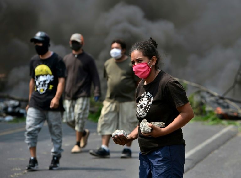 Hondurans block highway to prevent covid-19 burials