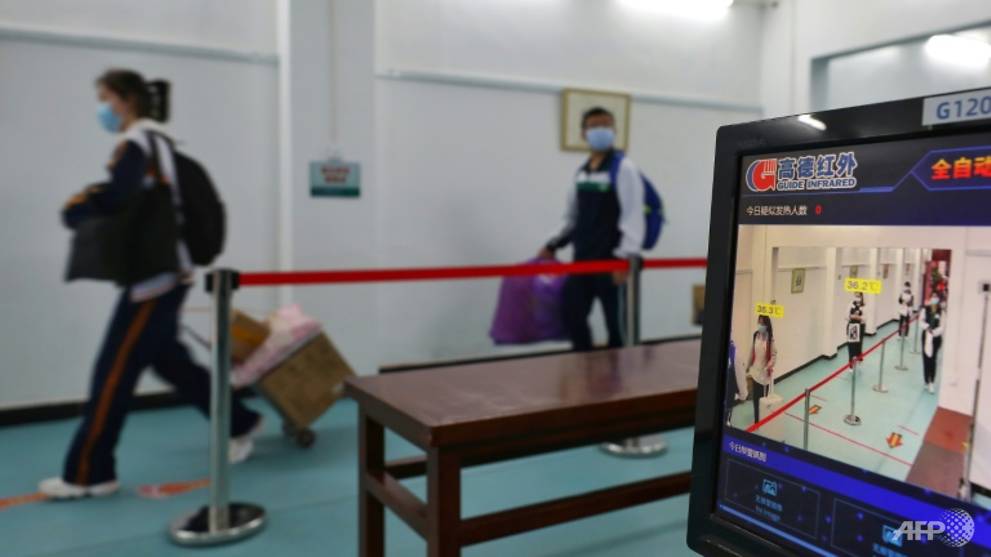 Students in China's virus epicentre Wuhan return to school