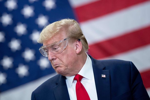 'Live and Let Die' blasted as Donald Trump tours coronavirus mask factory